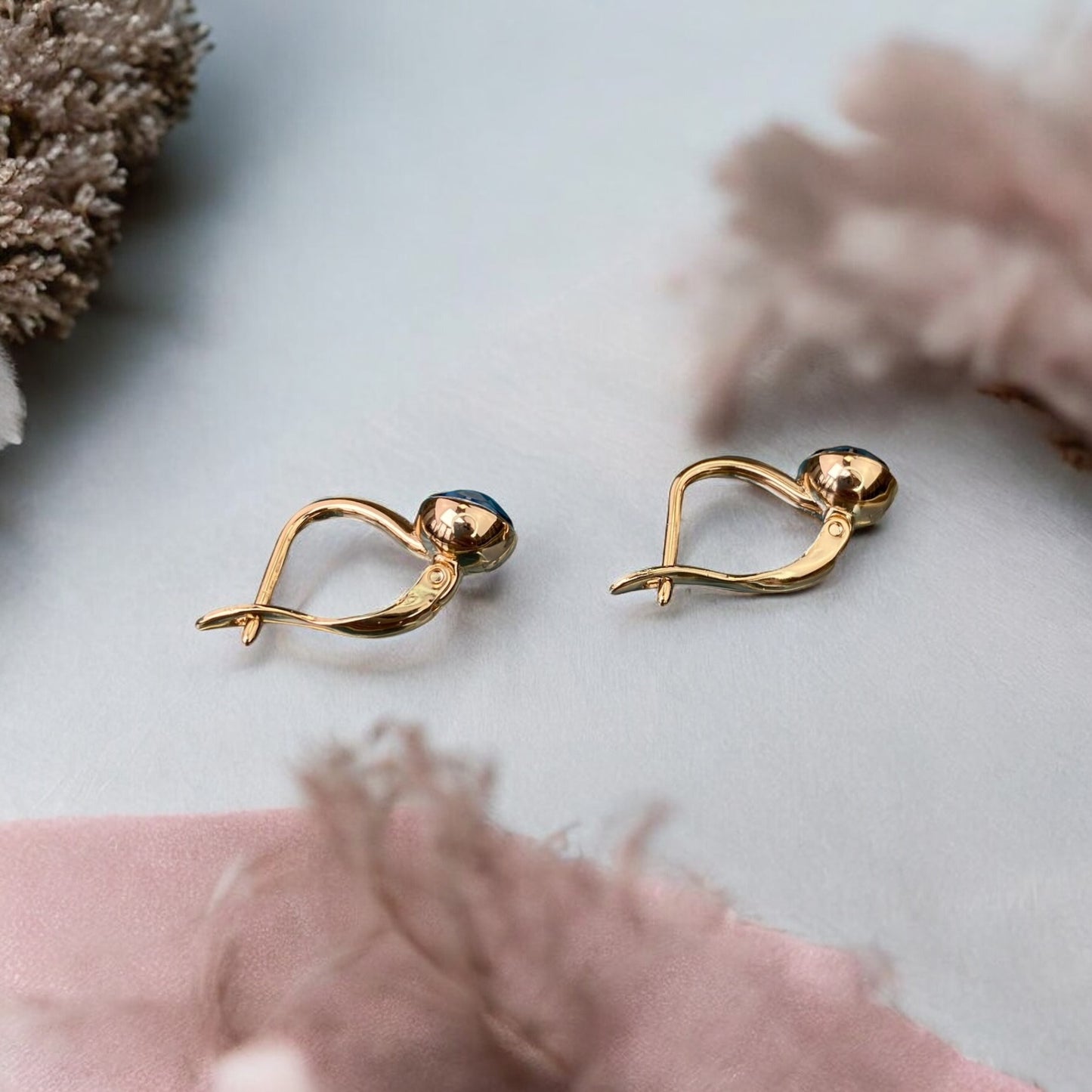 Gold Plated Stainless Steel Earrings with dark blue decorative crystal