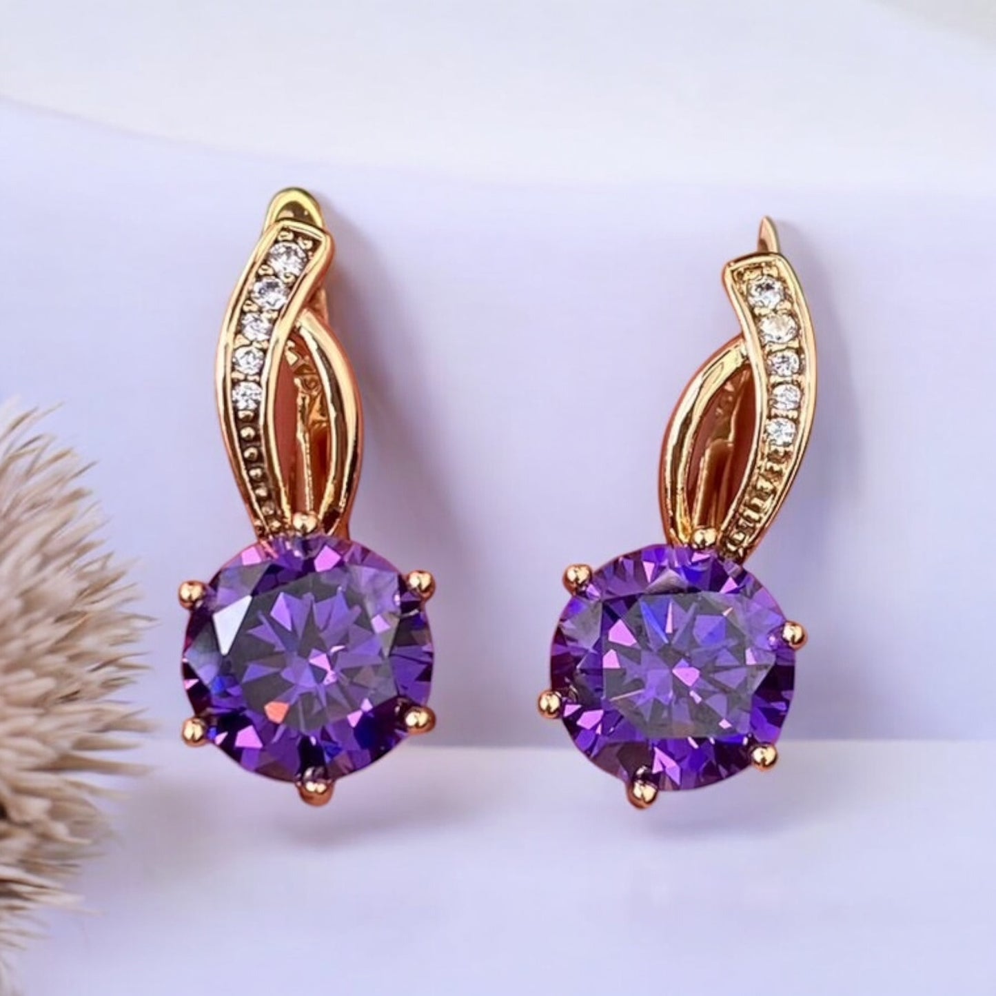 Gold Plated Stainless Steel Earrings with decorative purple crystal
