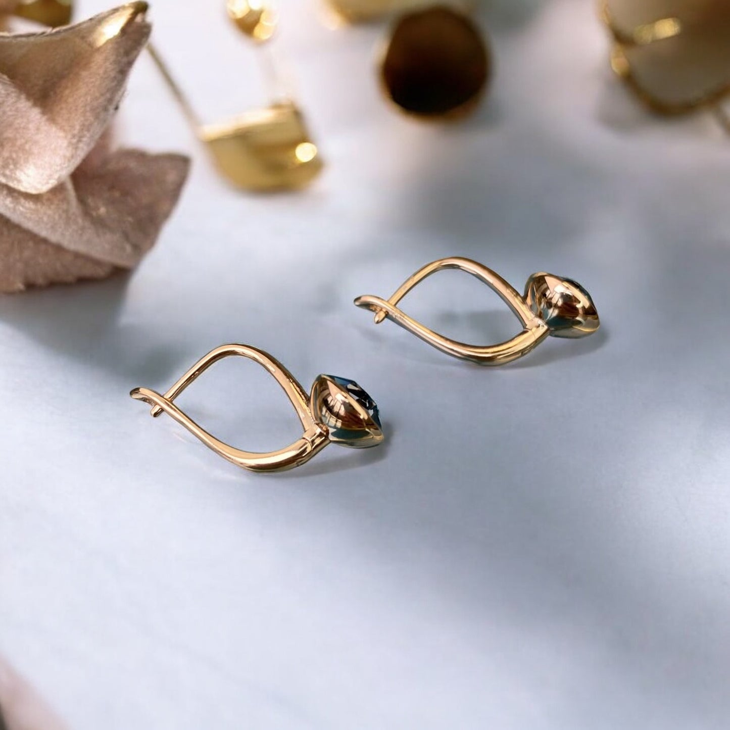 Gold Plated Stainless Steel Earrings with light blue decorative crystal