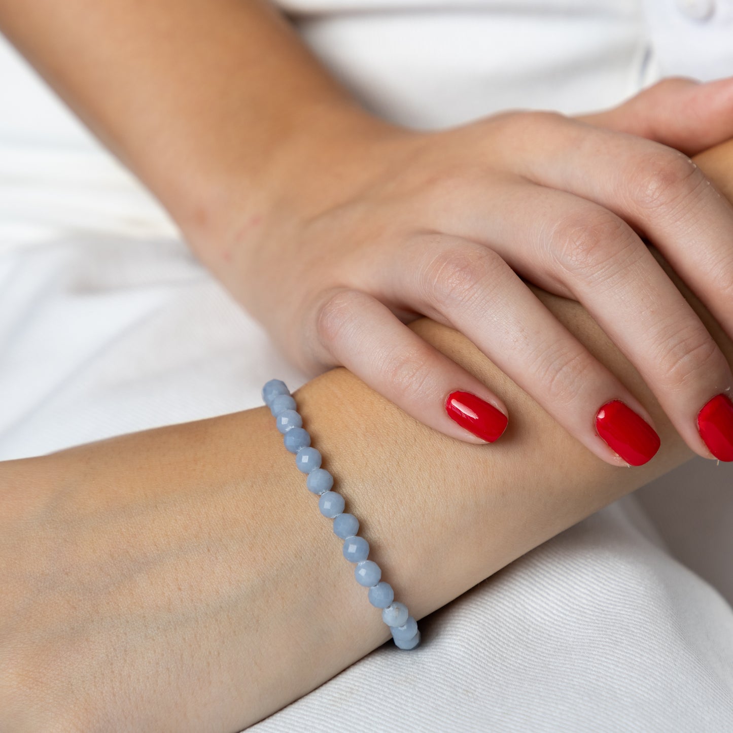 Angelite bracelet (Angelite, polished shape, 6mm. For positive energy, peace and self-expression.)